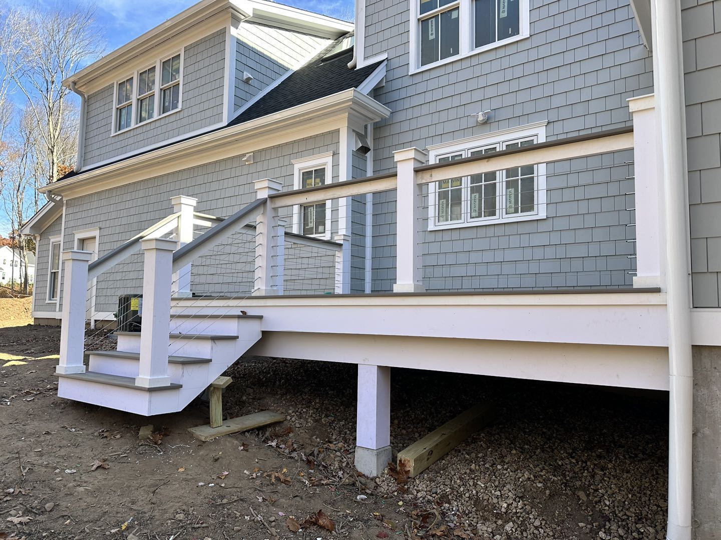 Cable railing following a residential stair run.